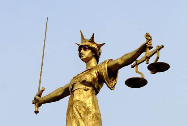A man who spat at a woman has been jailed