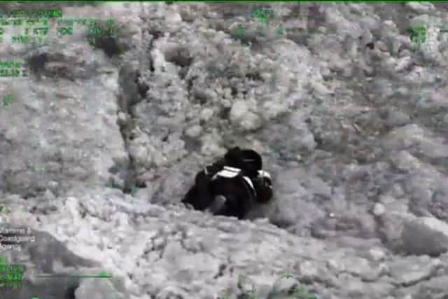 A still image from a video showing the moment the Lee-on-the-Solent Coastguard helicoper crew found a man who had gone missing on the Isle of Wight. Picture: HM Coastguard