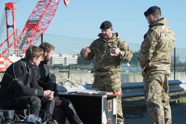 Explosive Ordnance Disposal units from the Royal Navy dispose of a CT-500 500lb bomb from World War Two in the water at London City Airport. Picture: Sgt Paul Randall RLC