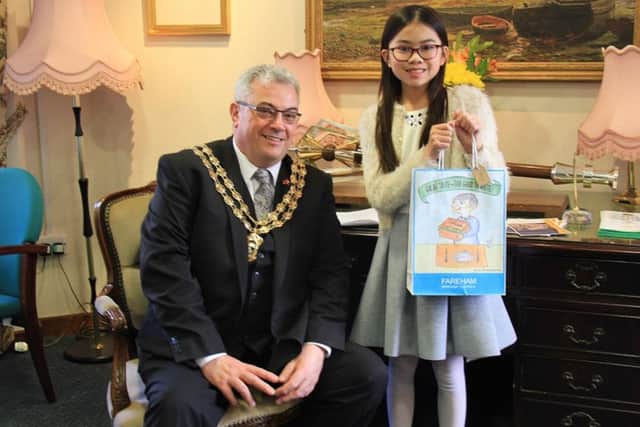 Mayor of Fareham, Councillor Geoff Fazackarley and Enya Chui with her winning bag design.
Picture: Fareham Borough Council