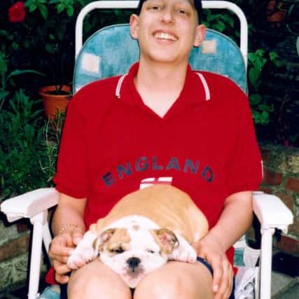 Tom Prince with 'Bubba', the bull terrier bought for him by Harry Redknapp