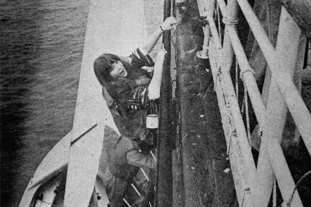 Nearly at the top for Vivien Carey as she climbs up the wall to the veranda of the Still and West