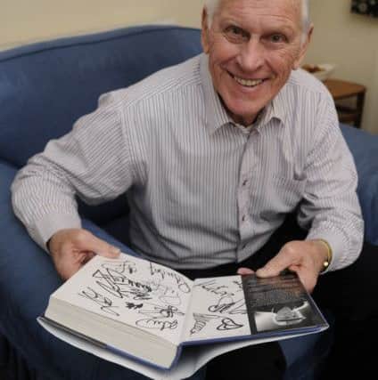Ray Crawford with his autographed book. Picture: Ian Hargreaves (180196-1)