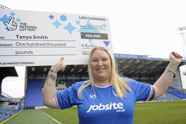 Tanya Smith, who works at Pompey, celebrates after winning Â£100,000 on a National Lottery scratchcard Picture: Ian Hargreaves (181098-3)