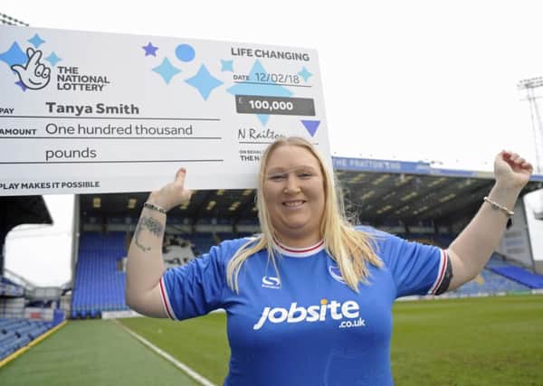 Tanya Smith, who works at Pompey, celebrates after winning Â£100,000 on a National Lottery scratchcard Picture: Ian Hargreaves (181098-3)