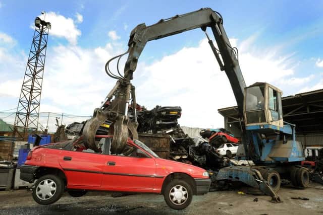 A car being scrapped in a breakers yard. Picture: John Stillwell/PA Wire