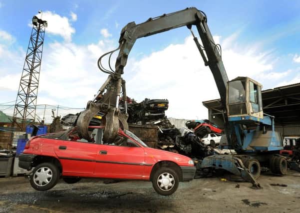 A car being scrapped in a breakers yard. Picture: John Stillwell/PA Wire