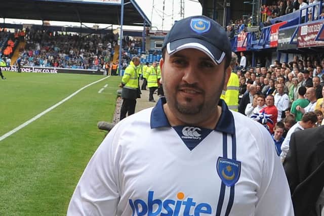 Sulaiman Al-Fahim meeting Pompey fans in the south stand in 2009. Picture: Steve Reid