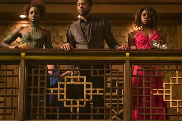 Lupita Nyongo as Nakia, Chadwick Boseman as Black Panther (TChalla) and Danai Gurira as Okoye.
