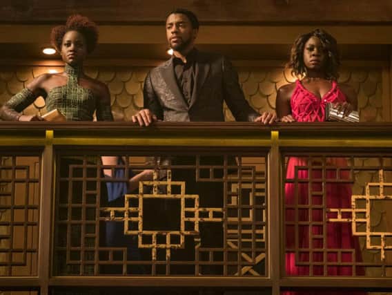 Lupita Nyongo as Nakia, Chadwick Boseman as Black Panther (TChalla) and Danai Gurira as Okoye.