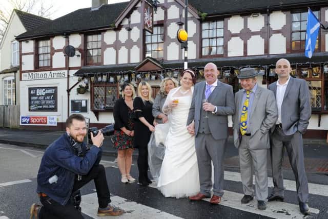 Darren and Lisa with some of the guests outside the Milton Arms where they had their reception. Picture by Malcolm Wells