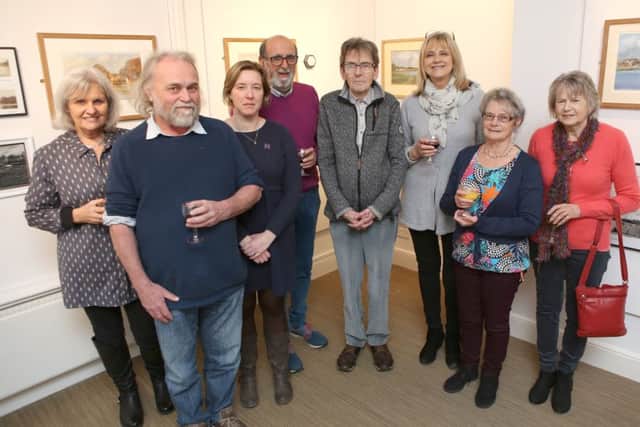 Richard Bradley (centre) with the volunteers and curators of the exhibition (180239-698)