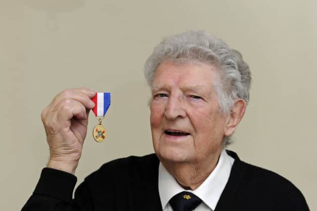 James Rhodes from Waterlooville with the medal he and his surviving shipmates have have been awarded for their work on the supply convoys which helped The Netherlands during the second world war     Picture Ian Hargreaves  (181100-1)