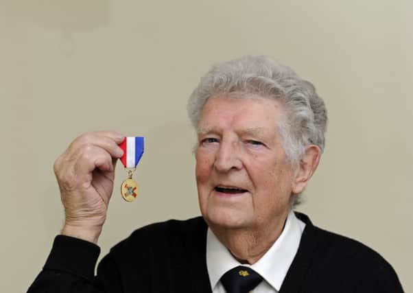 James Rhodes from Waterlooville with the medal he and his surviving shipmates have have been awarded for their work on the supply convoys which helped The Netherlands during the second world war     
Picture Ian Hargreaves  (181100-1)