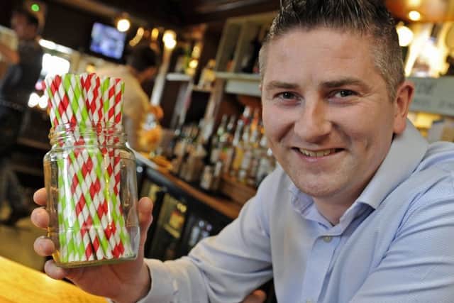 Mark Dawson, manager of the Ship Inn at Langstone with the new biodegradable straws which are now going to be used at the pub instead of plastic straws Picture: Ian Hargreaves (181101-1)