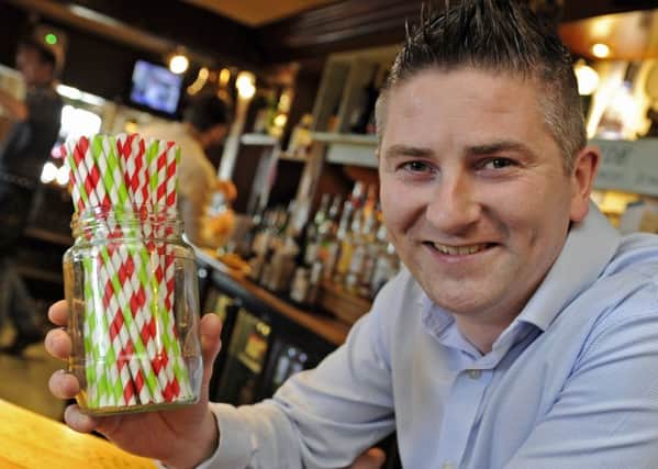 Mark Dawson, manager of the Ship Inn at Langstone with the new biodegradable straws which are now going to be used at the pub instead of plastic straws     Picture: Ian Hargreaves  (181101-1)