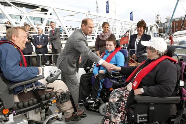 Anne Savidge, right, is introduced to Prince Edward on Geoff Holts boat Wetwheels in 2014. Geoff is pictured left