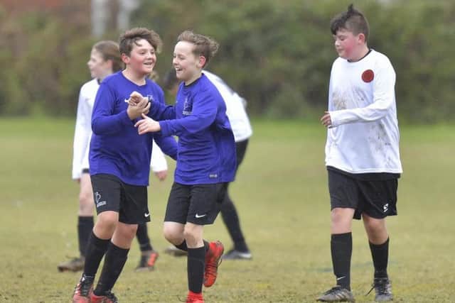 University of Portsmouth Scholars celebrate a goal. Picture: Neil Marshall (171733-397)