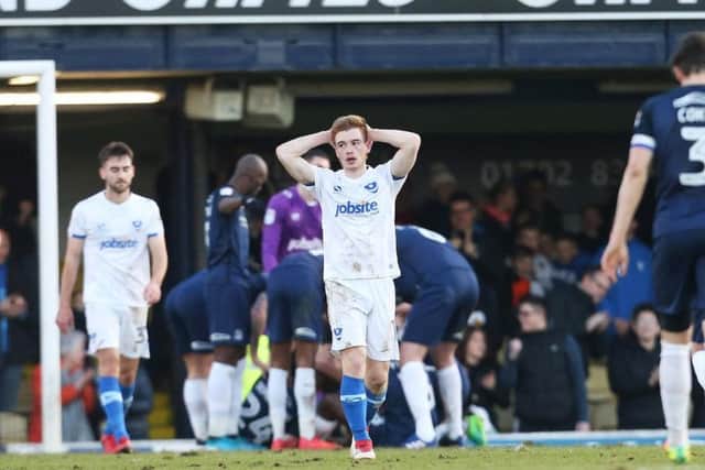 Substitute Connor Ronan holds his head in his hands as Pompey were well beaten at Southend today