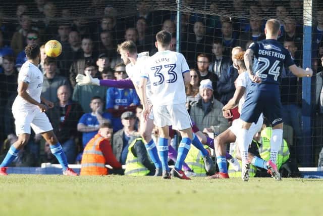 Jason Demetriou scores the second of his two goals against Pompey Picture: Joe Pepler