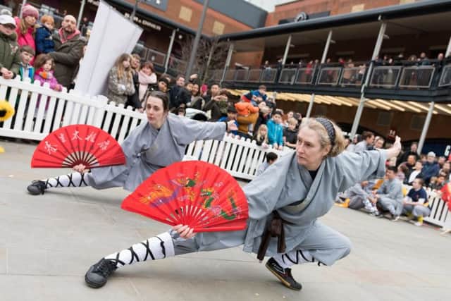 Dancing Chinese lions, drummers and a Chinese dragon from the UK Shaolin Temple parade through the shopping area of Gunwarf Quays, and provide a demonstration 'Kung Fu' skills
PICTURE: Duncan Shepherd