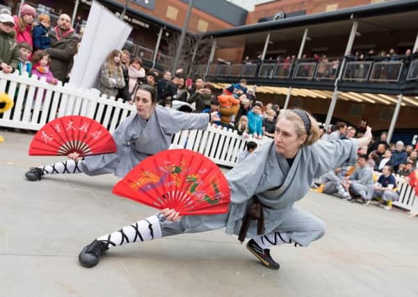 Dancing Chinese lions, drummers and a Chinese dragon from the UK Shaolin Temple parade through the shopping area of Gunwarf Quays, and provide a demonstration 'Kung Fu' skills

PICTURE: Duncan Shepherd