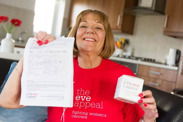 Gill Flynn, who is planning to swim the equivalent length of the English channel, with her charity sponsor forms Picture: Duncan Shepherd