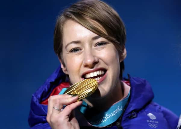 Great Britain's Lizzy Yarnold poses with her gold medal