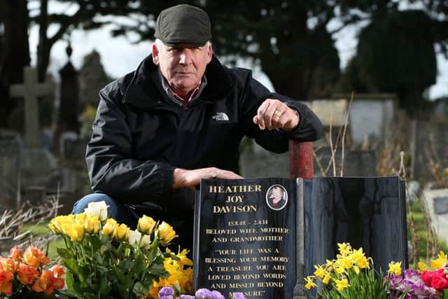 Dave Davison at the grave of his wife, Heather, at Anne's Hill Cemetery, Gosport, where his flowers were stolen Picture: Chris Moorhouse