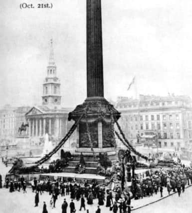 The base of Nelsons Column base in Trafalgar Square covered in wreaths. Picture: Pete Smith Collection.