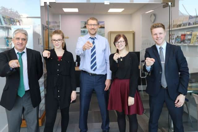 Editor of The News Mark Waldron (centre) with newsroom colleagues