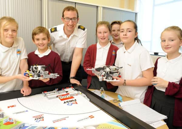 CPO Martin Owen helps Meon Junior School pupils with their Lego robots. Picture by Malcolm Wells