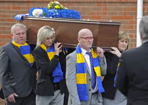 Mourners and football fans attend the funeral at St Johns Church in Gosport, of former football coach Ronnie Williamson who died without any family members