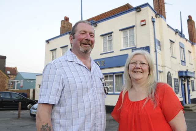 Katherine Proietti, landlady of the Sunshine Inn in Farlington with Brian Myall who has Parkinson's Desease. The pub has raised money for Parkinsons support in Cosham. Picture: Ian Hargreaves