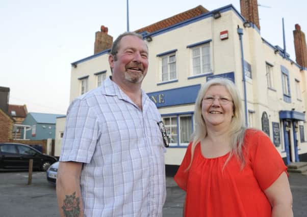 Katherine Proietti, landlady of the Sunshine Inn in Farlington with Brian Myall who has Parkinson's Desease. The pub has raised money for Parkinsons support in Cosham. 
Picture: Ian Hargreaves