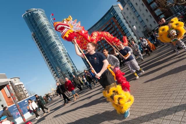 The dragon arrives at Gunwharf PICTURE: Duncan Shepherd