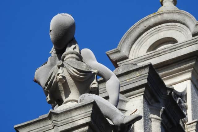 The bizarre figure perched on top of Charter House. Credit: Julie Potten