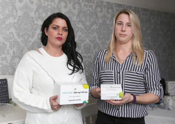 Gemma Weir and Michelle Frank with the medication they want to see prescribed by the NHS