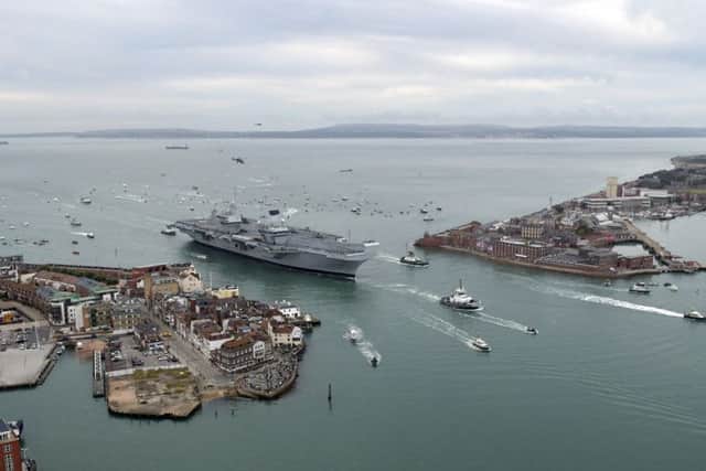 HMS Queen Elizabeth arriving into Portsmouth in August last year. Picture: Neil Marshall