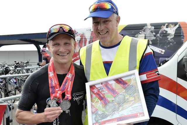 Champion Piotr Meller with duathlon organiser Rob Piggot. Picture: Neil Marshall (170306-18)