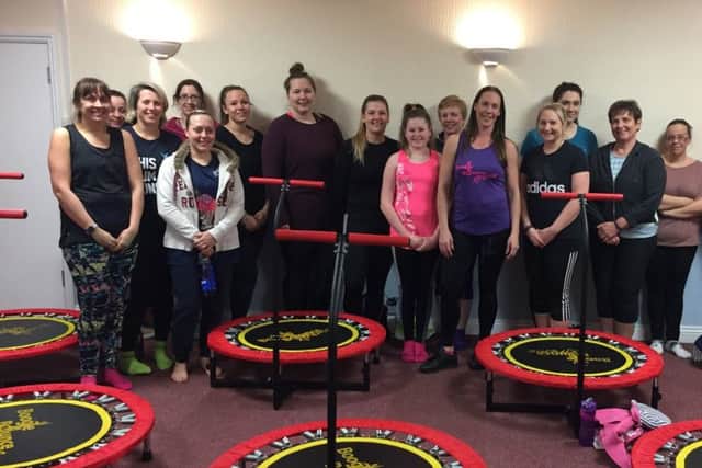 Claire Haines, middle, with members of her trampolining group