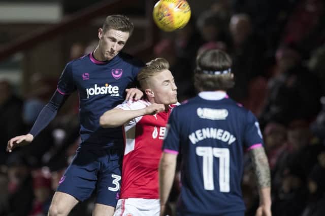 Pompey's Adam May wins a header. Picture: Mark Robinson