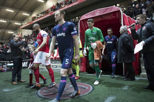 Matt Clarke leads Pompey out at Fleetwood. Picture: Mark Robinson