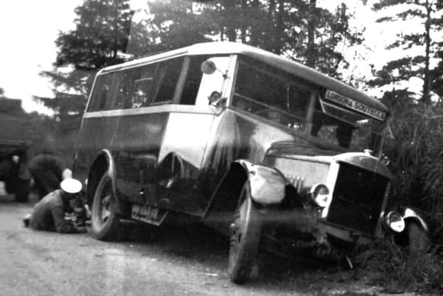 A 1931 scene at Hindhead in which a London to Southsea coach has come to grief.