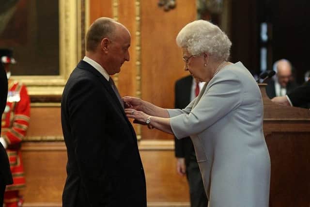 Professor Michael Tipton receives his MBE from the Queen