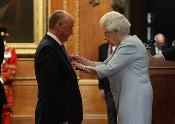 Professor Michael Tipton receives his MBE from the Queen