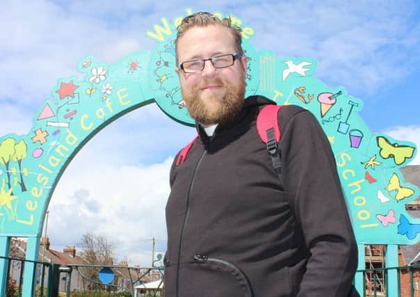 The Rev Tim Watson, outside the Leesland C of E Infant Schools in Gosport. He is setting up a new church.