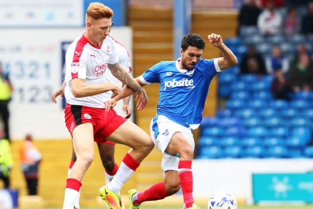 Josh Yorwerth battles Danny Rose for the ball during Crawley's clash with Pompey last season. Picture: Joe Pepler