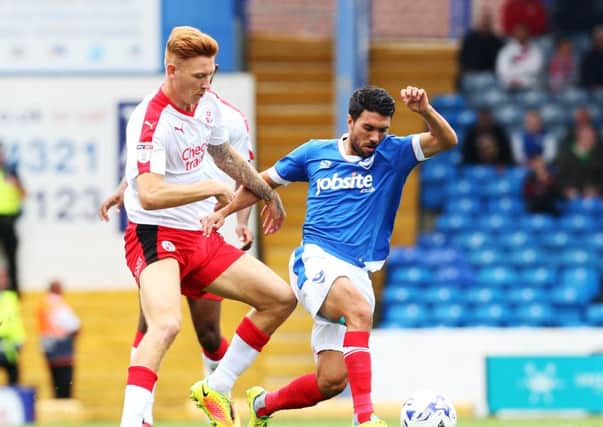 Josh Yorwerth battles Danny Rose for the ball during Crawley's clash with Pompey last season. Picture: Joe Pepler