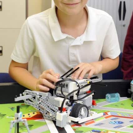 One of the meon Junior pupils at work on a robot